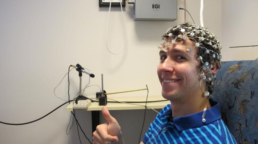 Elliot Layden wears an EEG net.